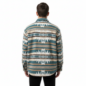 Person wearing a patterned shirt on a white background